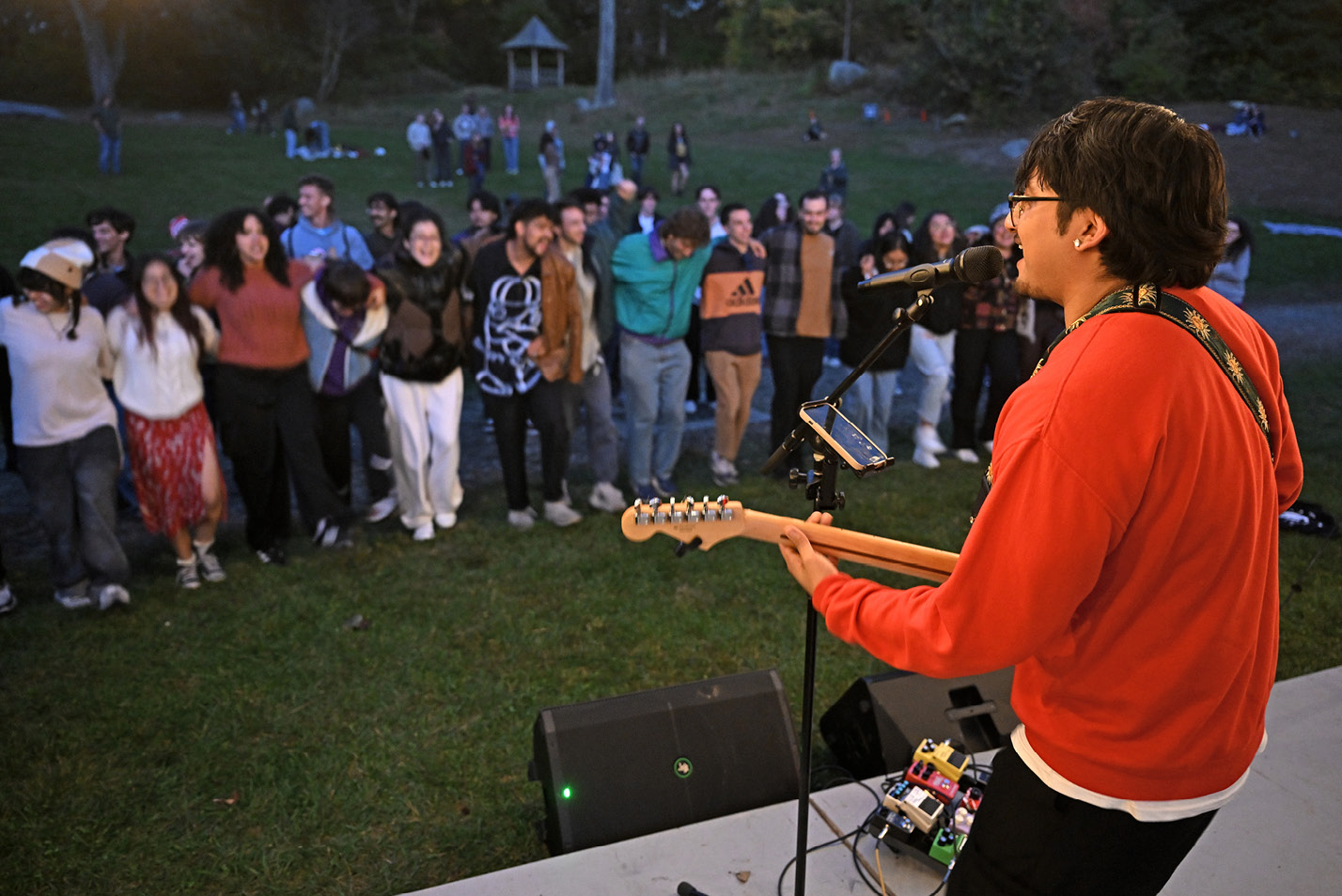 Guitarist performs to student fans during Arbofest at Fall Weekend 2024