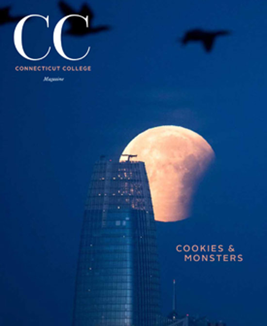 Nightime image of Salesforce building in San Francisco with moon behind it