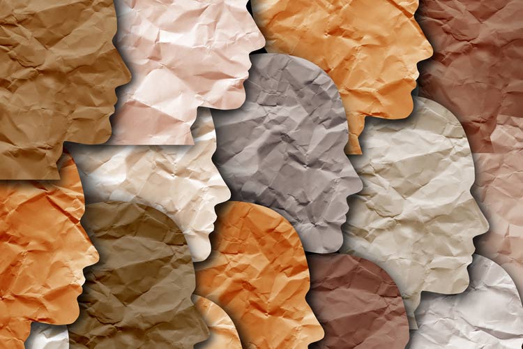 Abstract image of cut-paper heads of different colors