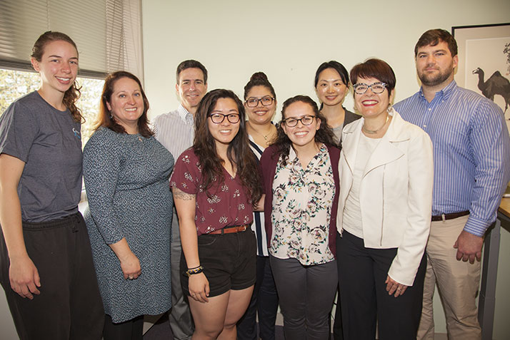 Kimberly Sanchez (Service Excellence Award), director of community partnerships next to President Katherine Bergeron and members of community partnerships. 