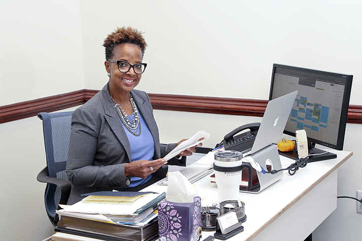 Hale Family Director of the Hale Center for Career Development Persephone Hall poses in her new office