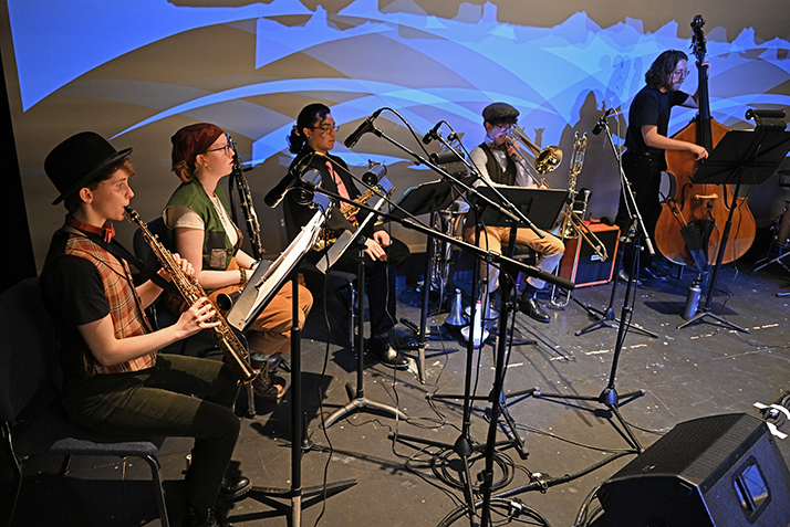 musicians warm up backstage