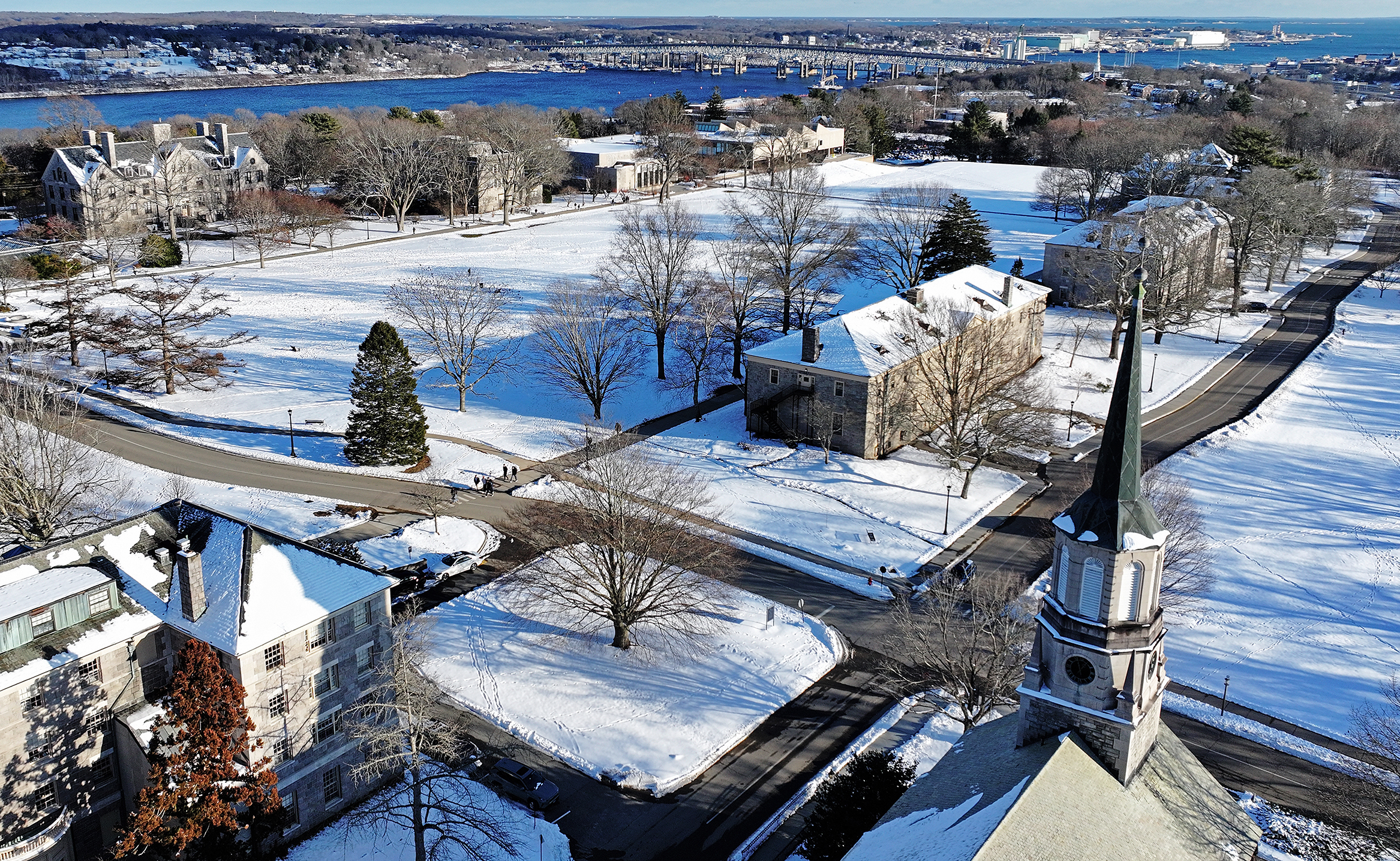 Snow blankets a college campus as seen from the air.