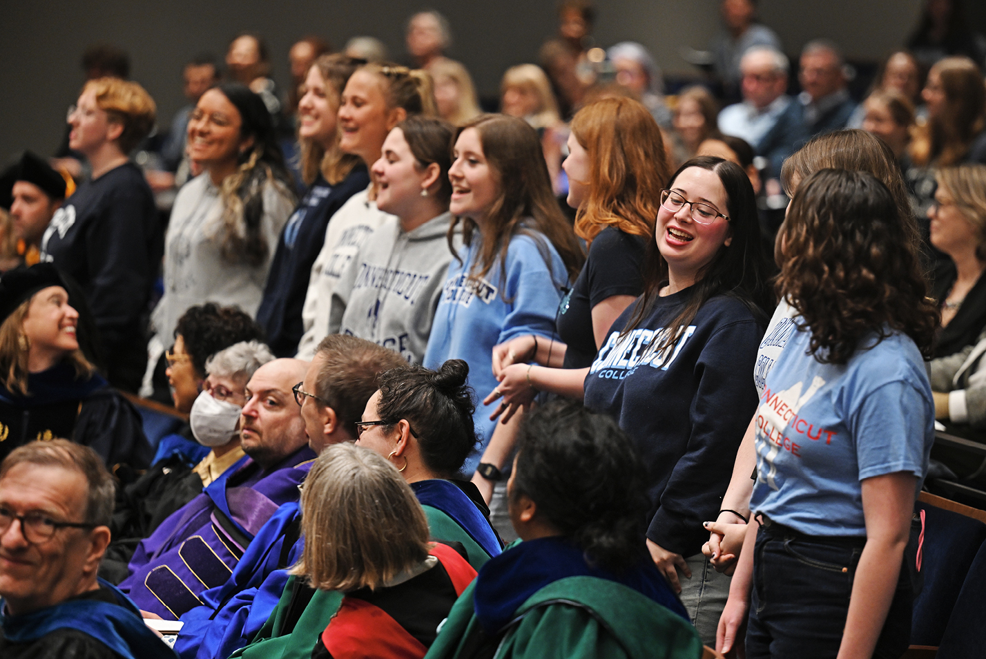 A flash mob choir rises from the crowd to sing at Inauguration